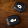Cool Handmade Leather AirPods Pro 3 Case iWoodStor Black leather cases with white dog illustrations on a wooden surface