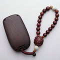 Wooden keychain with beads on a white background