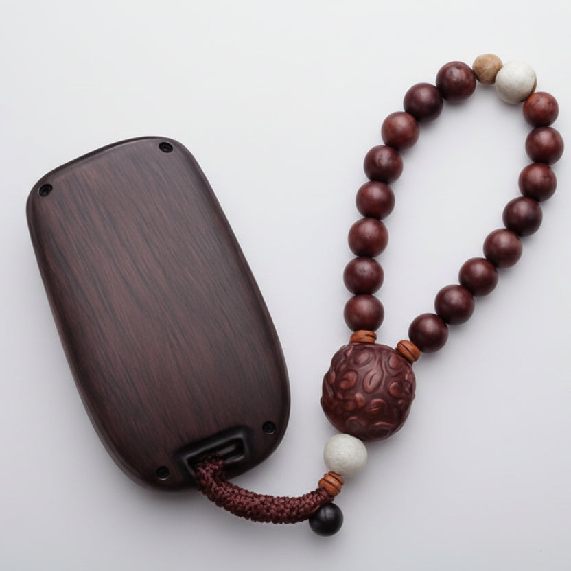 Wooden keychain with beads on a white background
