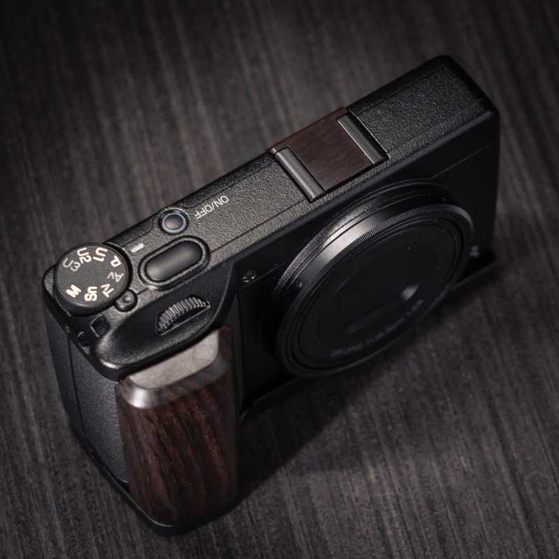 Ricoh GR4 Hotshoe Cover Wood iWoodStore Camera with wooden grip on a dark textured background