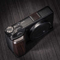 Ricoh GR4 Hotshoe Cover Wood iWoodStore Camera with wooden accents on a dark textured surface