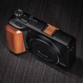 Ricoh GR4 Hotshoe Cover Wood iWoodStore Camera with wooden grip on a dark textured surface