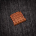 Ricoh GR4 Hotshoe Cover Wood iWoodStore Wooden square object on a textured dark surface
