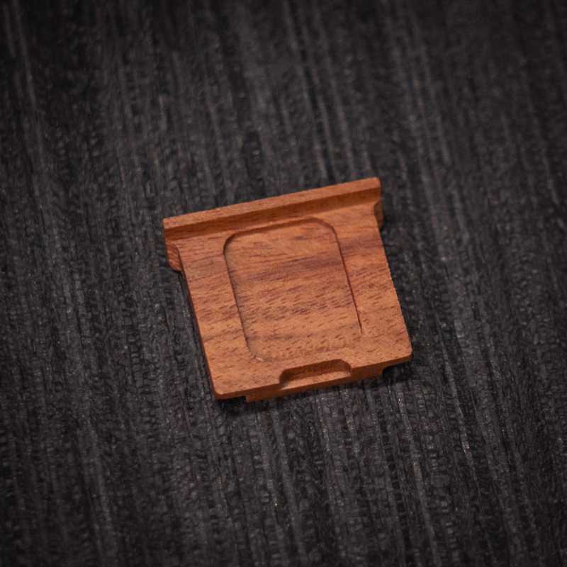 Ricoh GR4 Hotshoe Cover Wood iWoodStore Wooden square object on a textured dark surface