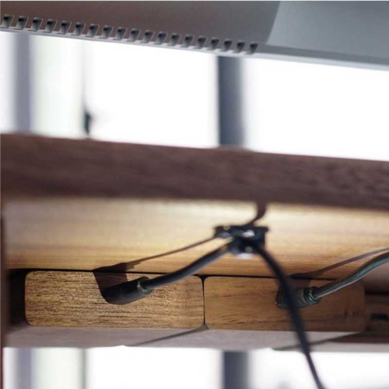 Wood Telescopic Retractable Data Cable Charging Cable For Desk iWoodStore Close-up of a wooden shelf with metal brackets against a blurred outdoor background