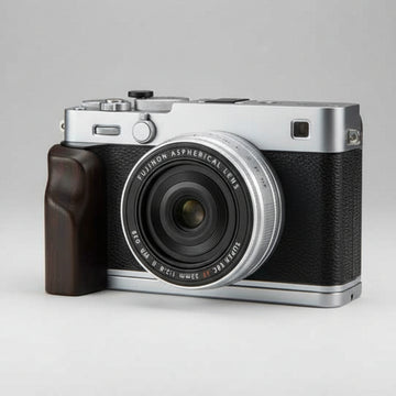 Camera with wooden grip on a dark background