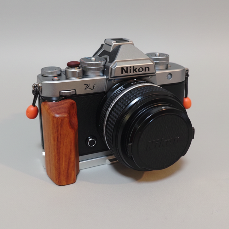 Nikon ZF camera with rosewood wooden grip on a light surface